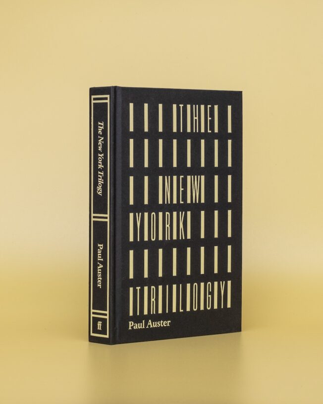 Faber Members Edition of Paul Auster's New York Trilogy on a pale yellow background Faber Members Edition of Paul Auster's New York Trilogy on a pale yellow background