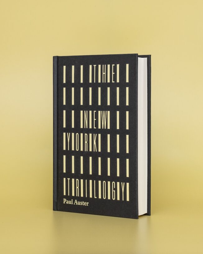 Faber Members Edition of Paul Auster's New York Trilogy on a pale yellow background Faber Members Edition of Paul Auster's New York Trilogy on a pale yellow background