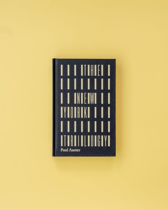 Faber Members Edition of Paul Auster's New York Trilogy on a pale yellow background Faber Members Edition of Paul Auster's New York Trilogy on a pale yellow background