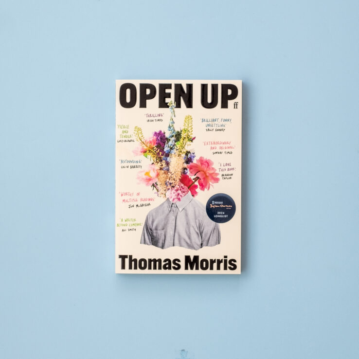 Paperback of Open Up by Thomas Morris on a blue background Paperback of Open Up by Thomas Morris on a blue background