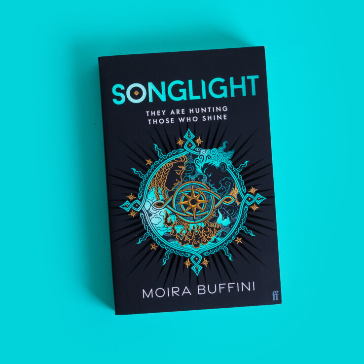 Songlight Trilogy book on a light blue background Songlight Trilogy book on a light blue background